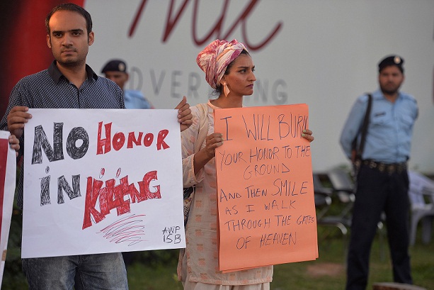Pakistani civil society activists carry placards during a protest in Islamabad on July 18, 2016 against the murder of social media celebrity Qandeel Baloch by her own brother. The brother of a murdered Pakistani celebrity said he is "not embarrassed" to have killed her, as Qandeel Baloch's death reignited polarising calls for action against the "epidemic" of honour killings. The strangling of Baloch, judged by many in deeply conservative Muslim Pakistan as infamous for selfies and videos that by Western standards would appear tame, has prompted shock and revulsion. / AFP / AAMIR QURESHI        (Photo credit should read AAMIR QURESHI/AFP/Getty Images)