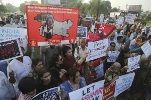 Pakistani civil society activists rally to express solidarity with Indian Kashmiris in Lahore, Pakistan, Tuesday, Aug. 20, 2019. Sardar Masood, the president of Pakistani-administered Kashmir has welcomed efforts by U.S. President Donald Trump to lower tensions between Pakistan and India over the disputed Himalayan region and warned of a humanitarian crisis and food shortages in the Indian-held portion. (AP Photo/K.M. Chaudhry) ORG XMIT: ISL106