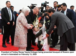 President of Turkey Recep Tayyip Erdogan being presented bouquet of flowers upon arrival in Islamabad on February 13, 2020