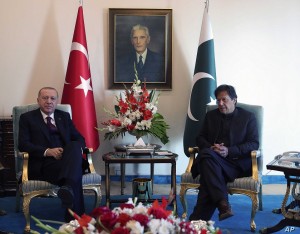 Turkey's President Recep Tayyip Erdogan, left, and Pakistan Prime Minister Imran Khan pose for photos before a meeting, in Islamabad, Pakistan, Friday, Feb. 14, 2020. Erdogan is in Pakistan for a two-day state visit.(Presidential Press Service via AP, Pool)