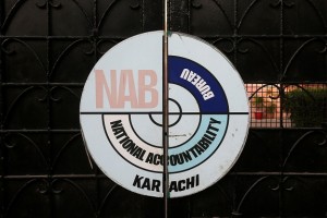A logo of the National Accountability Bureau (NAB) is seen on the main entrance of their office in Karachi