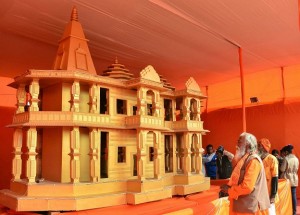 Allahabad: People look at a model of Ram Mandir, to be built in Ayodhya showcased at Kumbh Mela festival 2019, in Allahabad, Friday, Jan 18, 2019. (PTI Photo) (PTI1_18_2019_000188B)