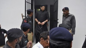 Shahrukh Jatoi, top center, convicted of killing 20-year-old Shahzeb Khan, is escorted by members of the police to an Anti-Terrorism court in Karachi, Pakistan, on Friday.
