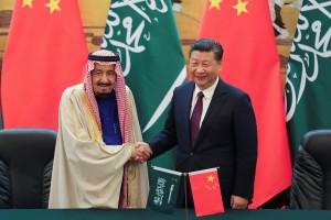China's President Xi Jinping and Saudi Arabia's King Salman bin Abdulaziz Al-Saud shake hands during a signing ceremony at the Great Hall of the People in Beijing